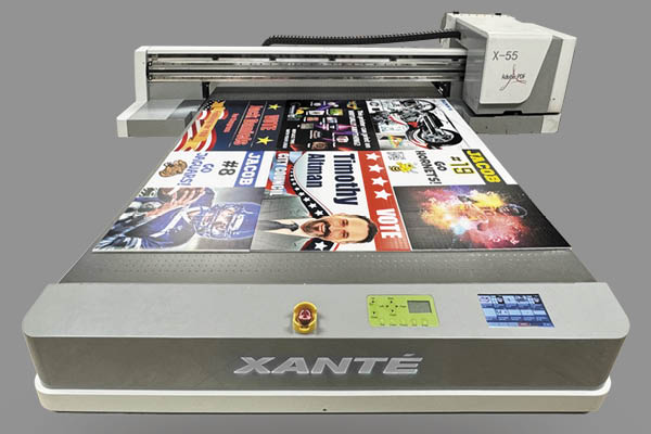 Flatbed printer with various printed signs on the bed